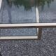 Golden and iridescent metal desk with a glass top from the 70s/80s.