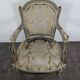 Cream lacquered Louis XVI style cabriolet salon with gold highlights.
