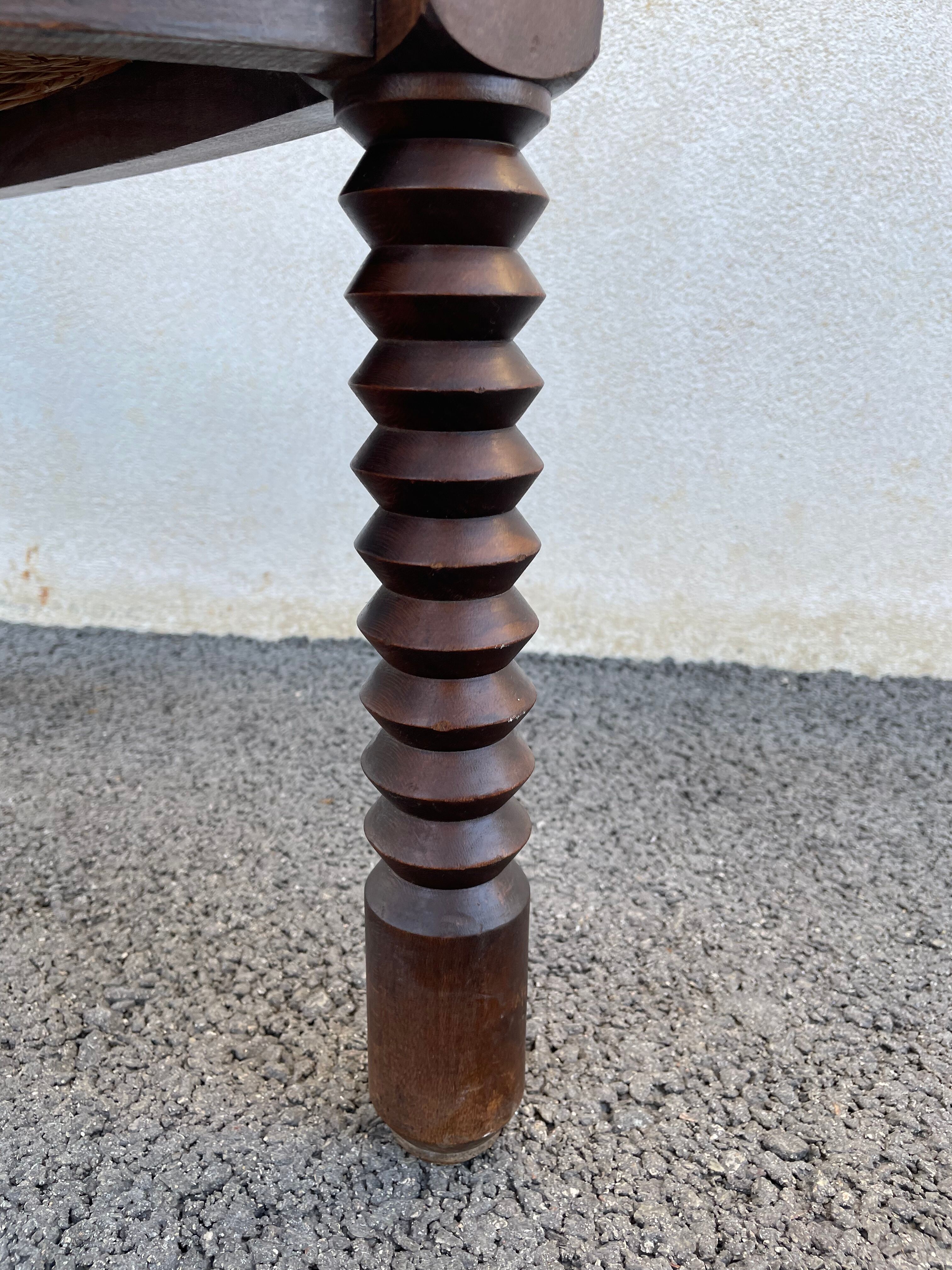 Vintage armchair in straw and brutalist wood