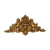 Pediment with patinated characters golden