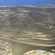 Etched brass and inlaid agate coffee table by Felix De Boussy, Belgium