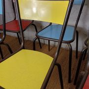 8 canteen chairs, yellow, blue, and red Formica with metal tubing from the 1950s-60s.