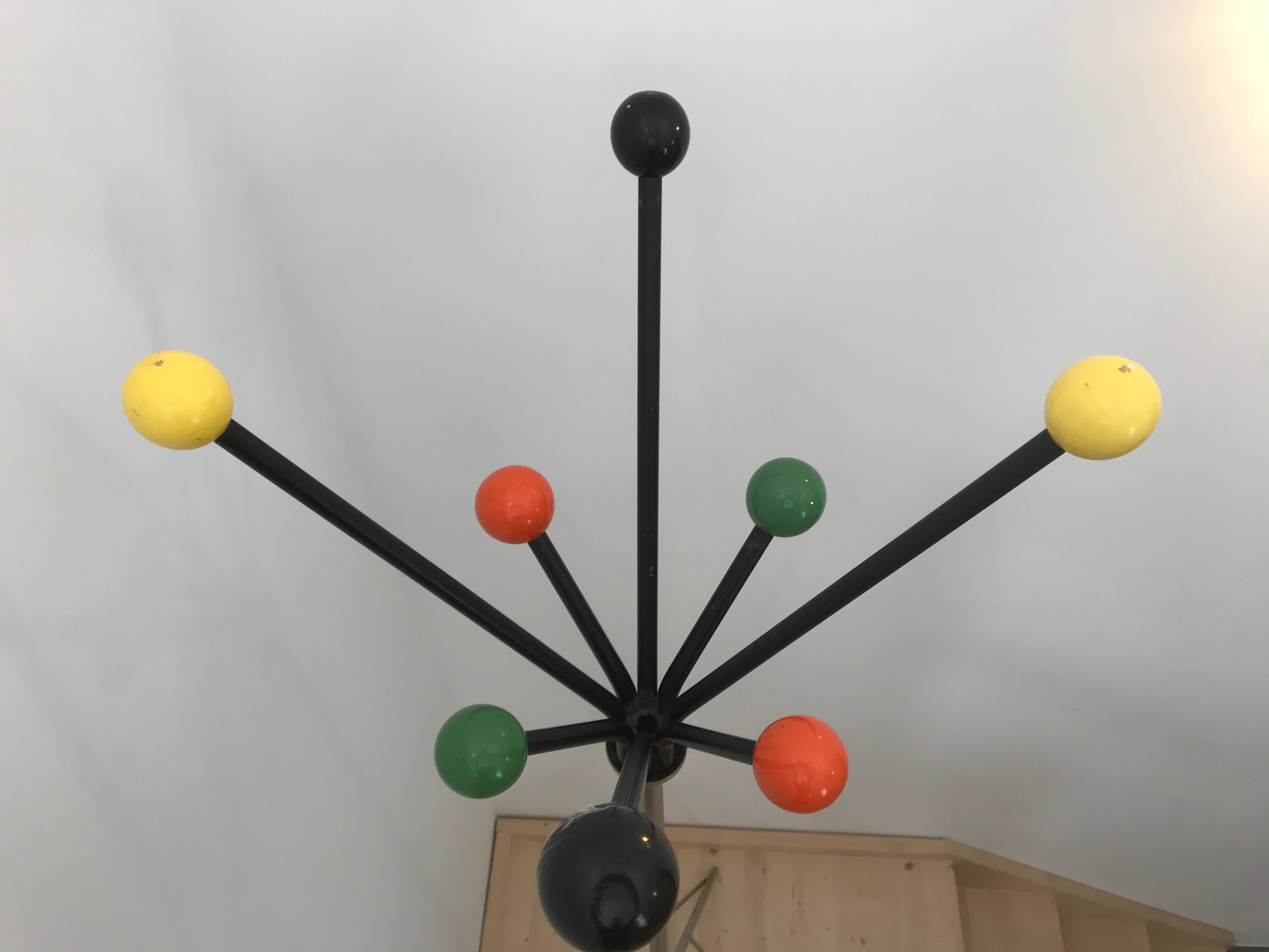 Wearing chrome parrot coat, black and multicolored balls