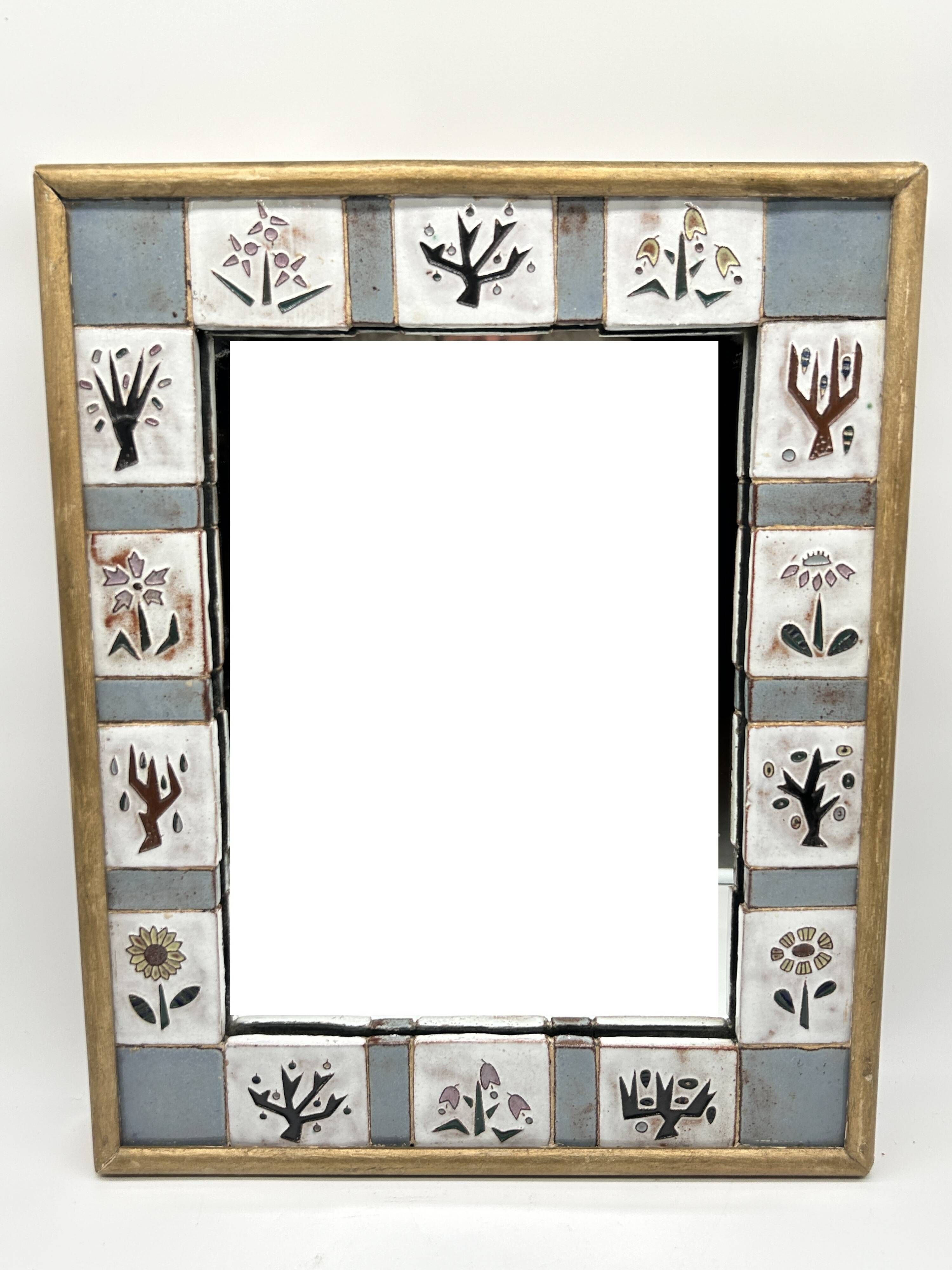 Ceramic enamelled mirror in the style of Odette Dijeux.