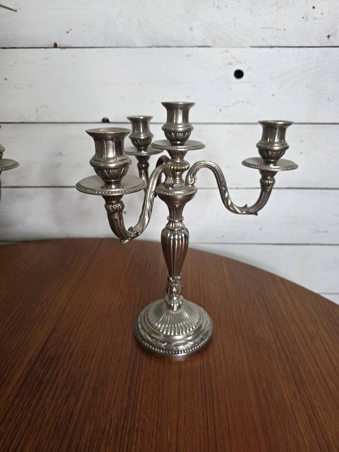 Pair of Louis XVI style candlesticks in silver-plated bronze