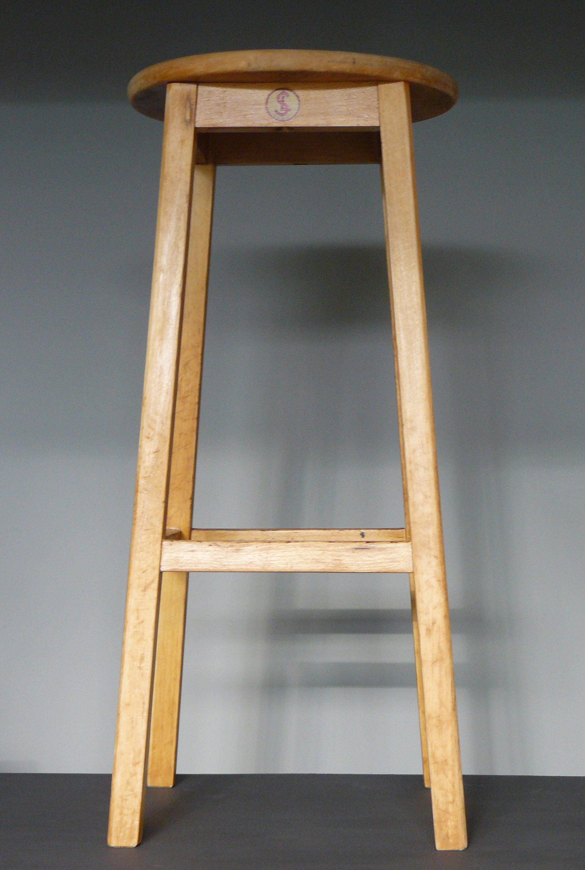 High wooden tabouret
