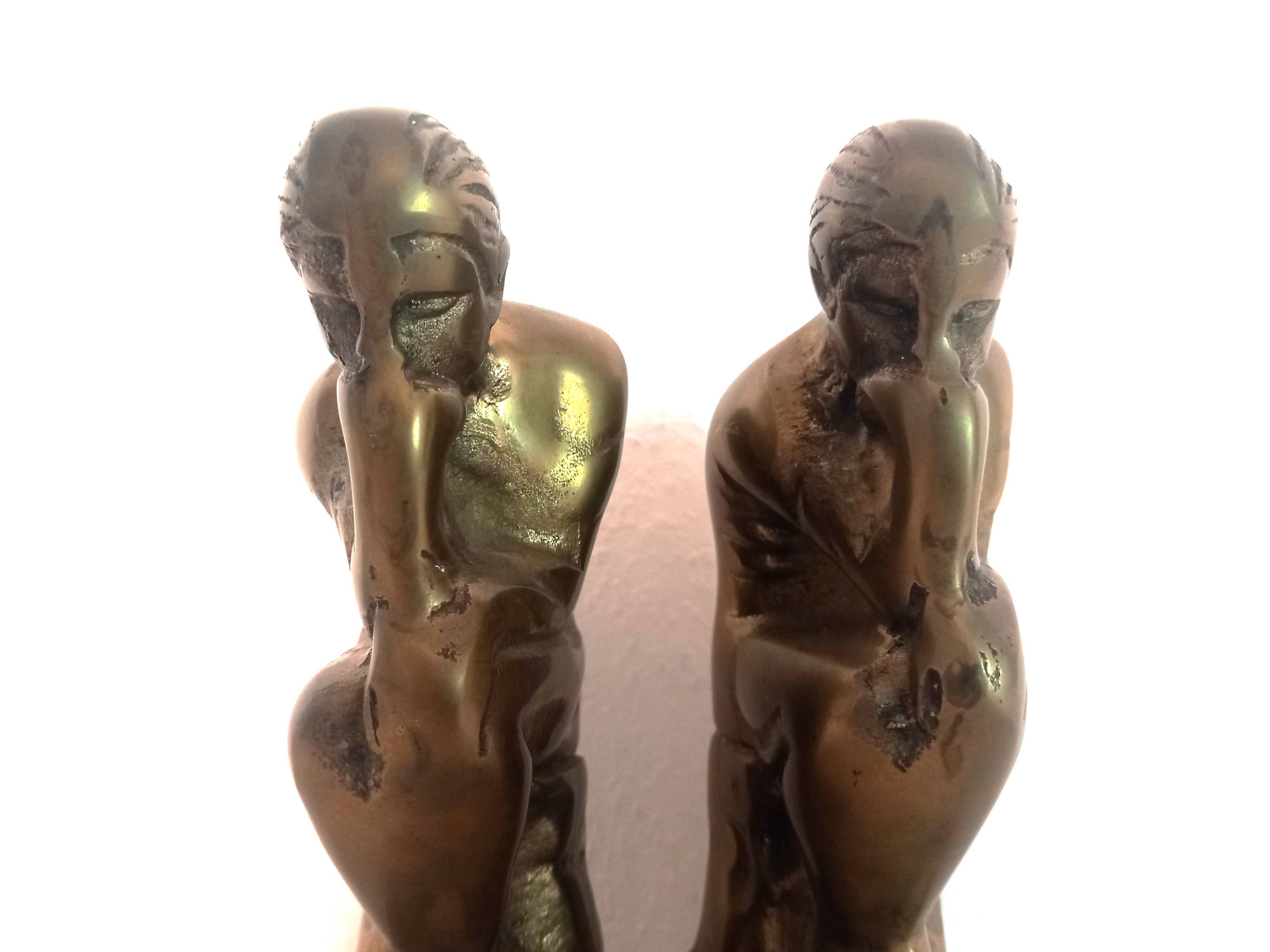 Pair of brass "thinker" bookends