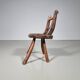 Rustic Wabi-Sabi style accent chair in dark curved hardwood, 1900s.