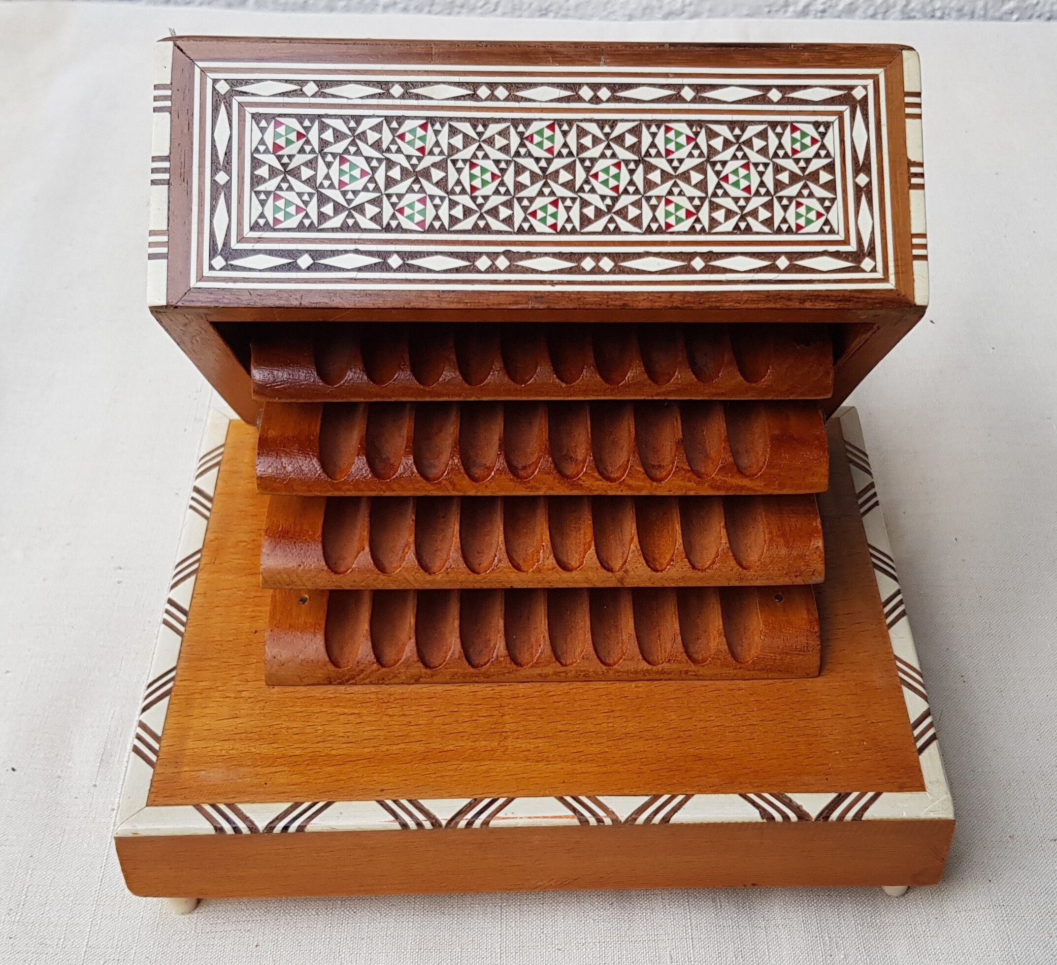 Wood cigarette box and mother-of-pearl inclusion