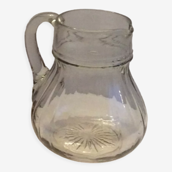 Old glass jug pitcher with grooved structure