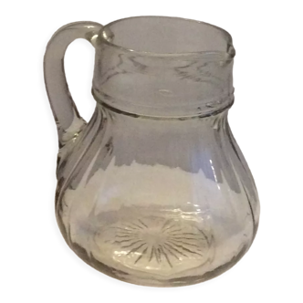 Old glass jug pitcher with grooved structure