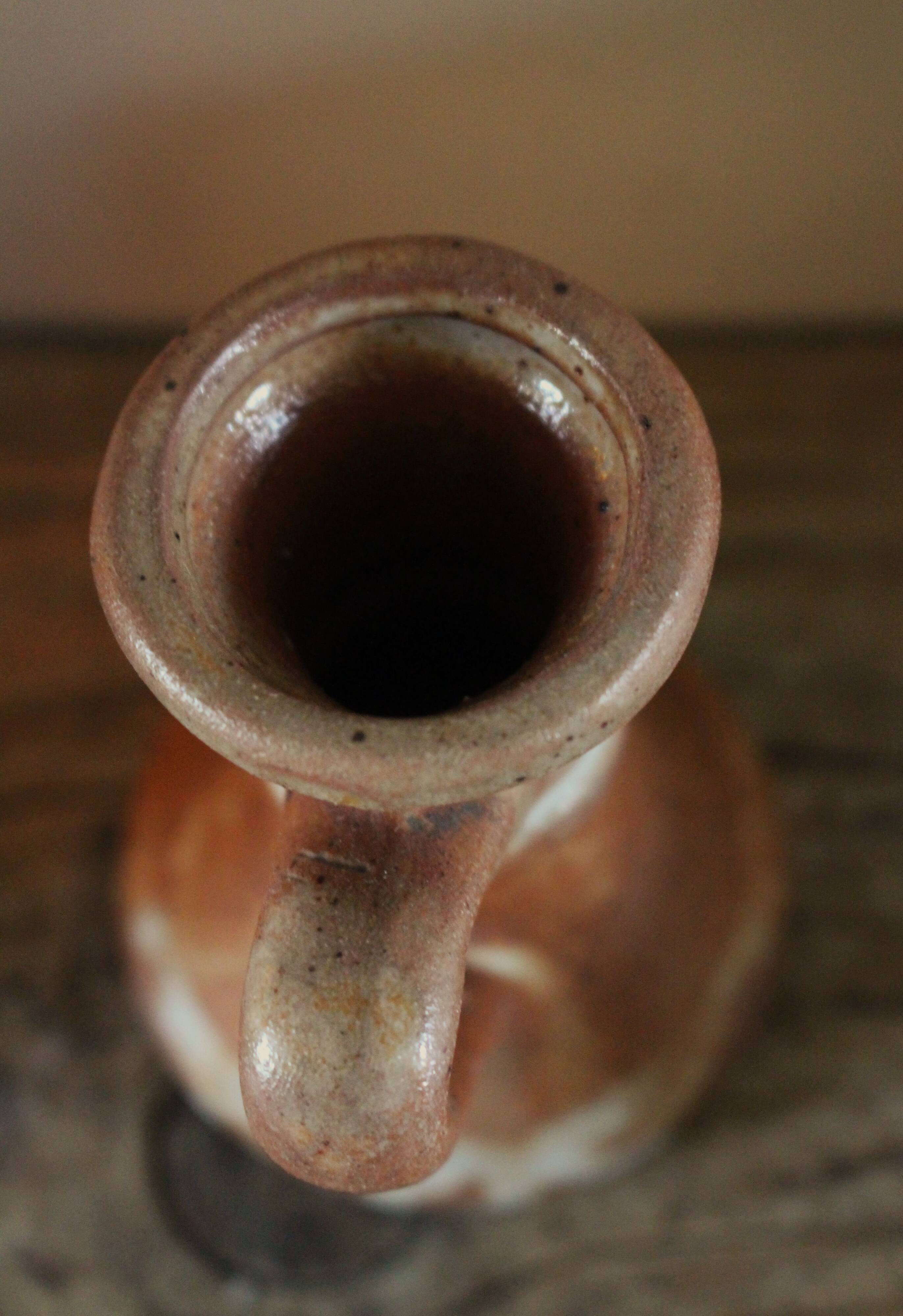 Small vintage marbled stoneware candlestick with handle