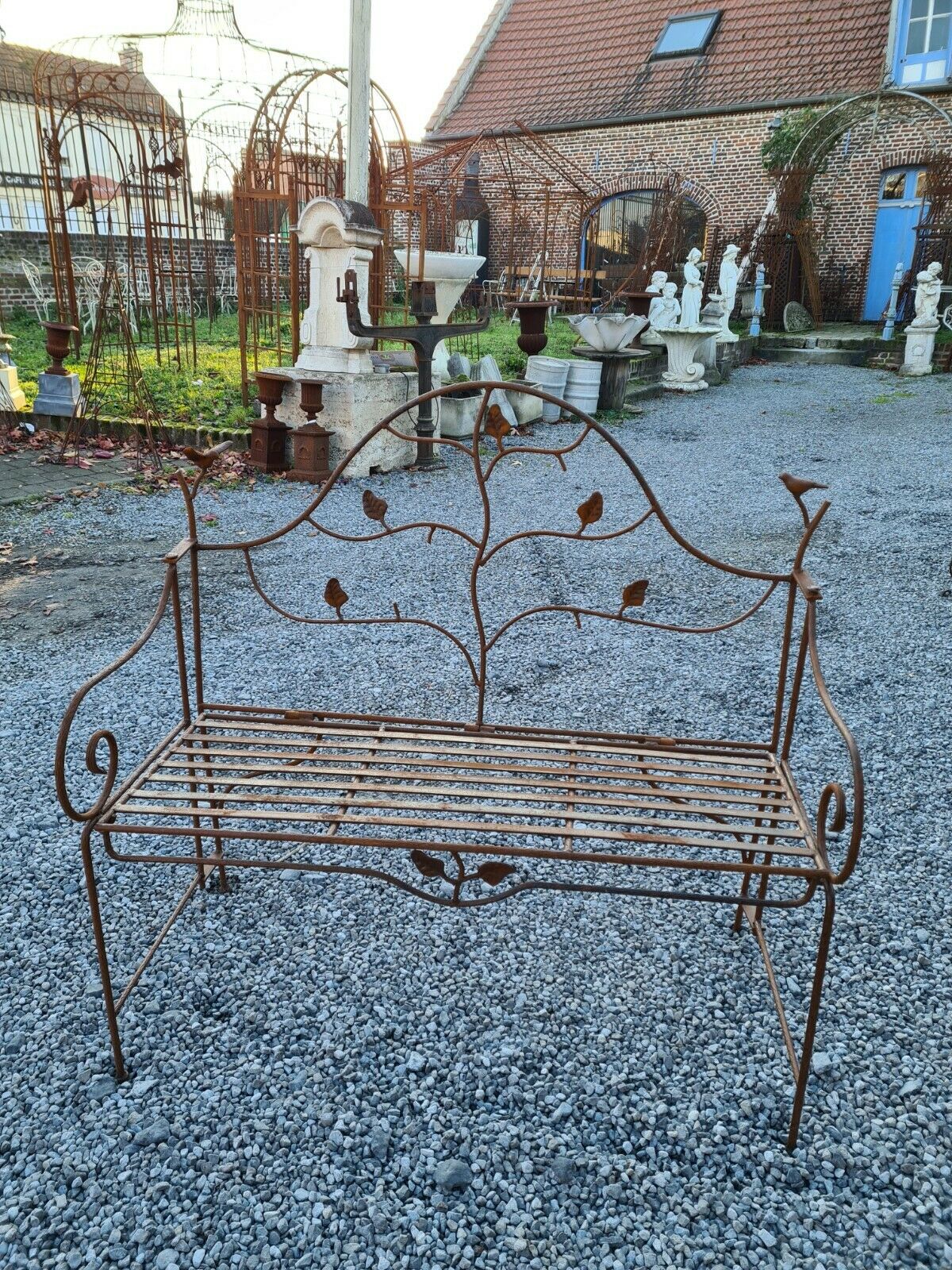 Wrought iron garden bench with birds