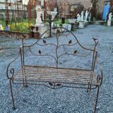 Wrought iron garden bench with birds