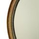 Miroir ovale vintage en résine dorée à la feuille d'or, style années 60. Classique.