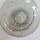 Cracked glass vase encircled with wrought iron.