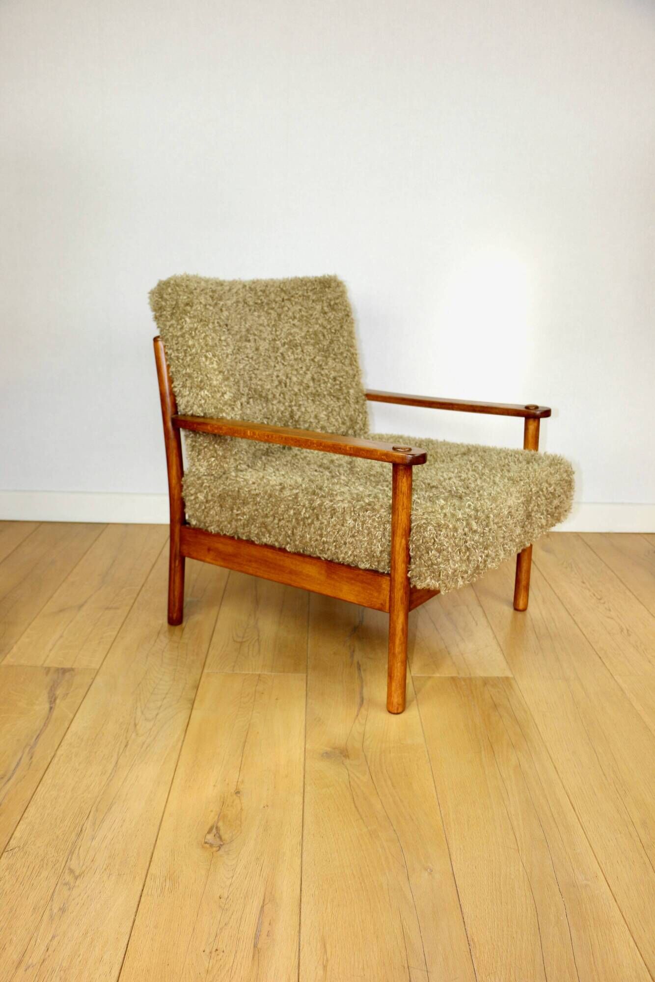 Wooden vintage brown armchair, olive green, long pile on removable cushions