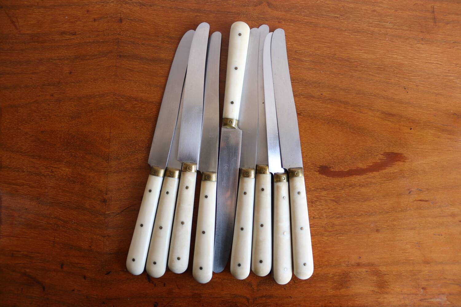 Set of 9 vintage cream table knives