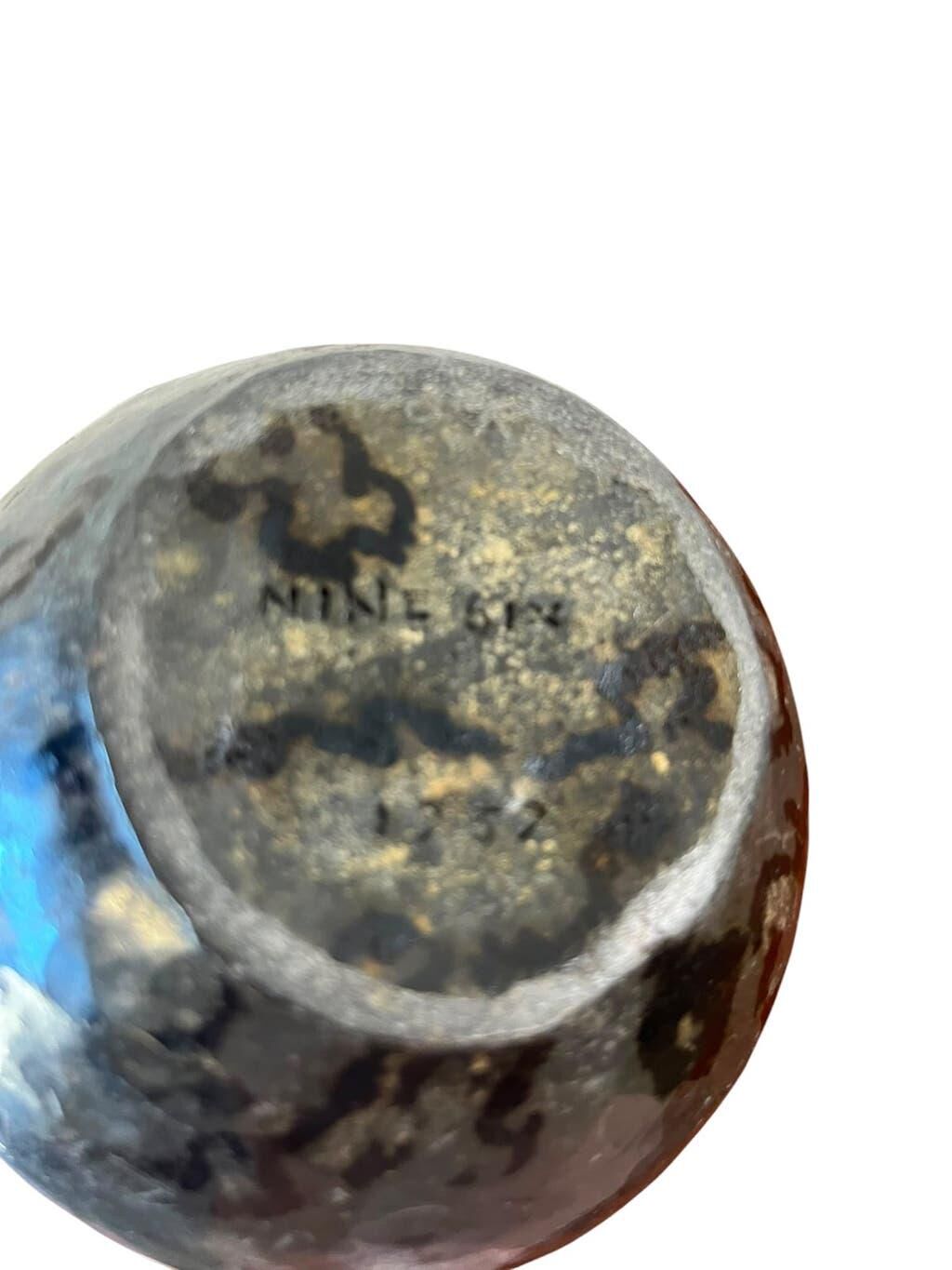 Vintage stone vase with worked fossil