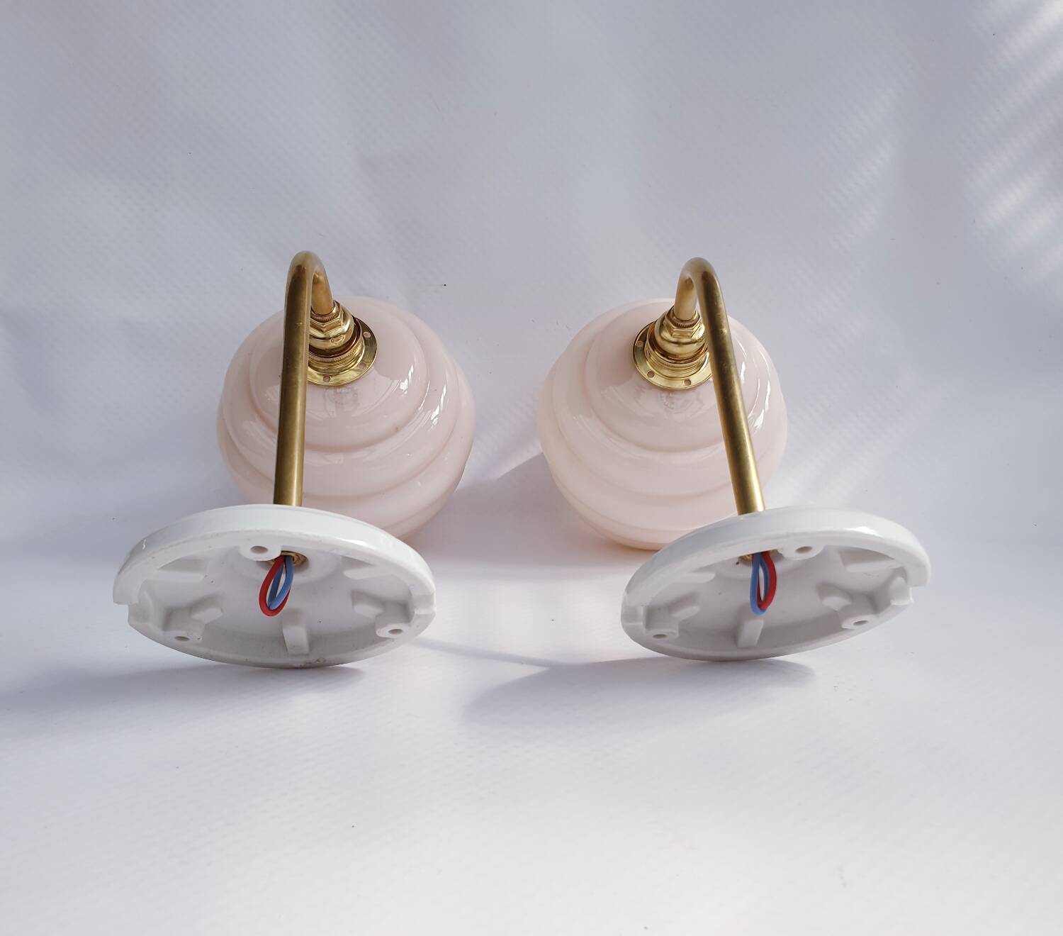 Swan neck and glass globe wall lights