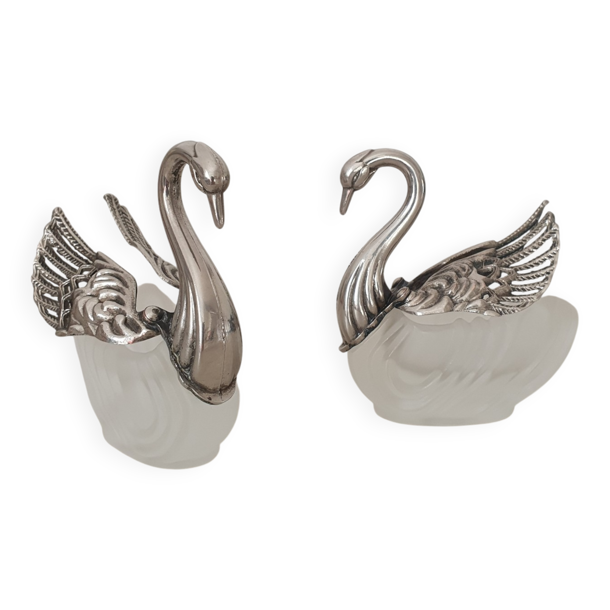 Two frosted glass swan salt cellars with silver plating.