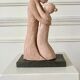 Sculpture of a couple entwined in grog clay.