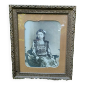 Framed portrait of a young girl.