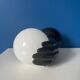 Vintage wall sconce with black hand and white opaline glass globe, 1970s L