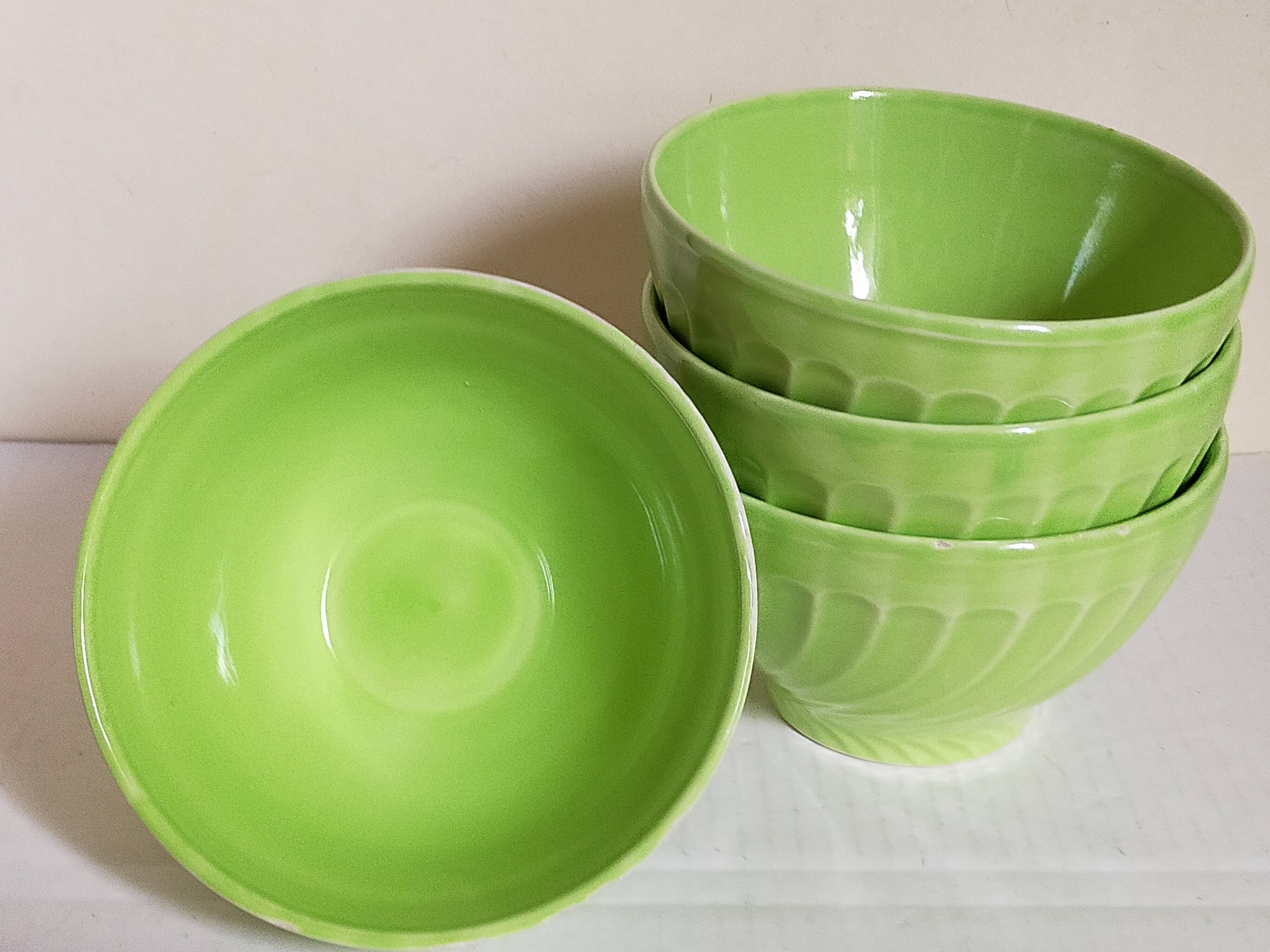 Four vintage spring green earthenware bowls