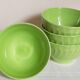 Four vintage spring green earthenware bowls