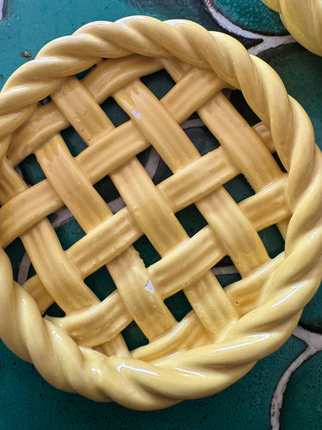 2 yellow ceramic trivets and knife rests