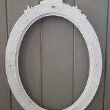 Old oval frame patinated white