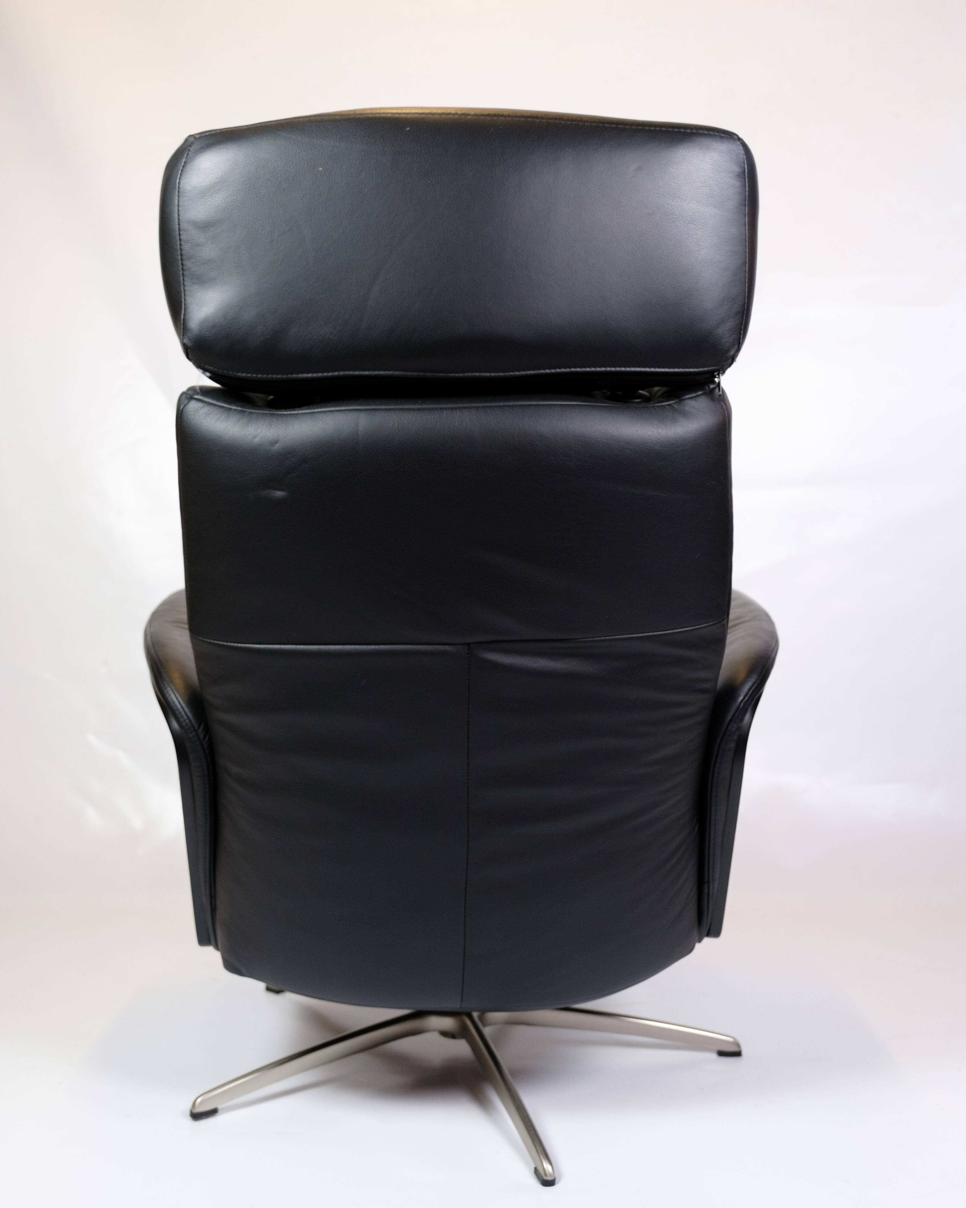 Lounge chair made in black leather & aluminium swivel from 1970s