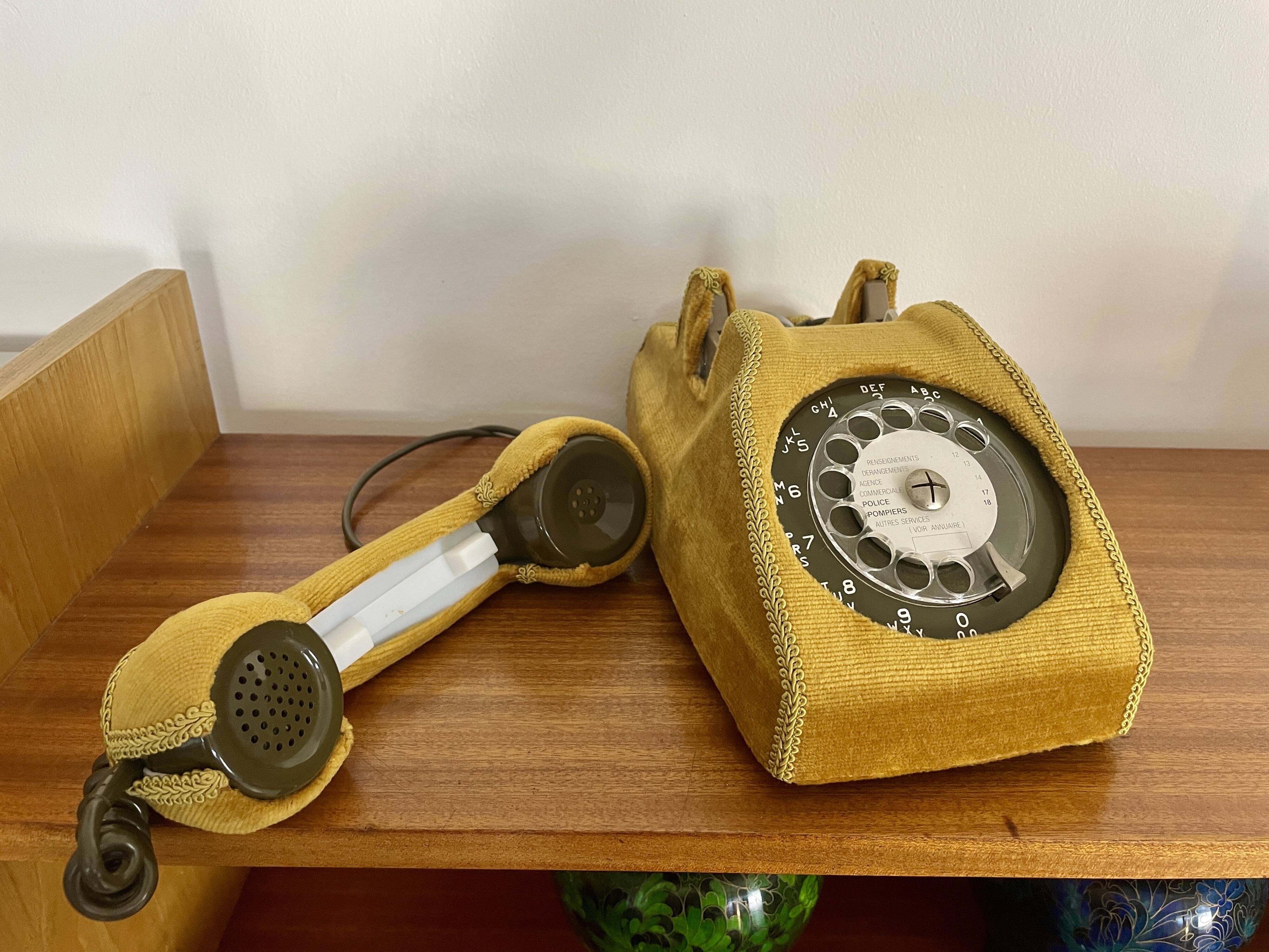 Socotel S63 telephone with its gold velvet shell