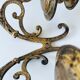 Old wall candle holder in golden brass