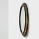 Miroir ovale néoclassique français en noir et or, 20e siècle