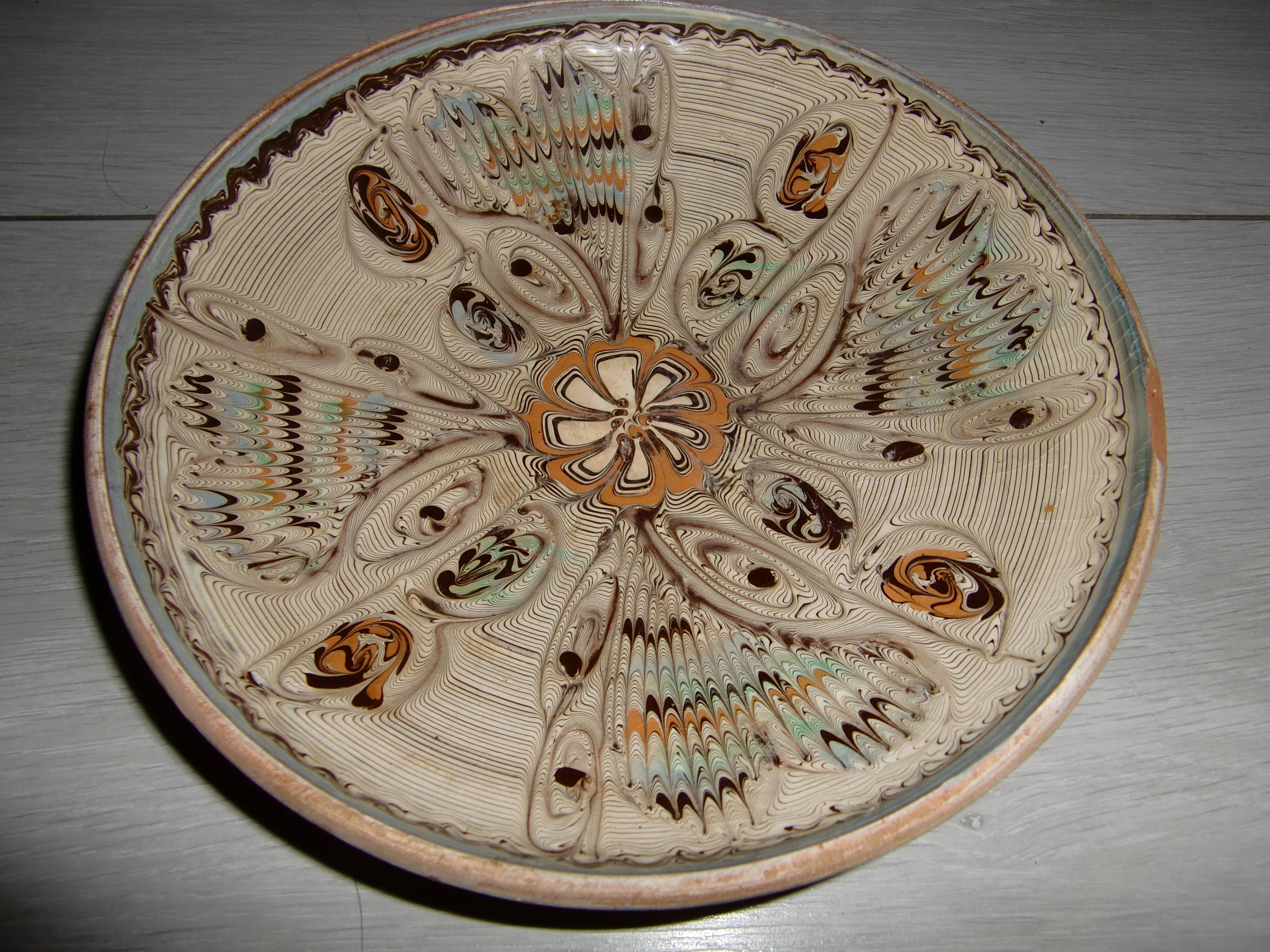 Hand decorated terracotta plate