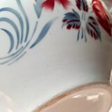 Mismatched old soup plates accompanied by a soup tureen