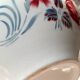 Mismatched old soup plates accompanied by a soup tureen