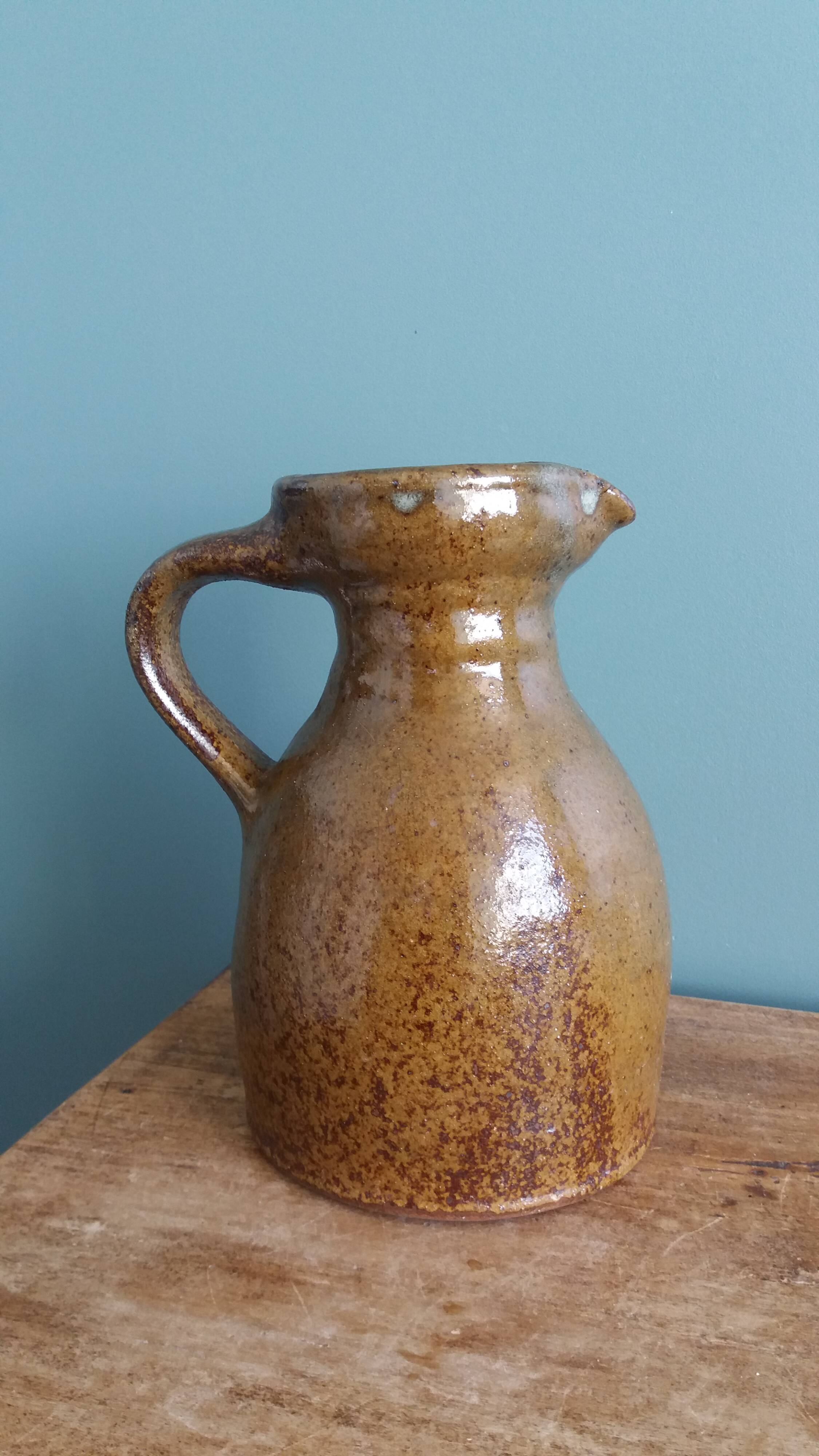 Rustic stoneware jug, chic countryside.