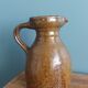 Rustic stoneware jug, chic countryside.