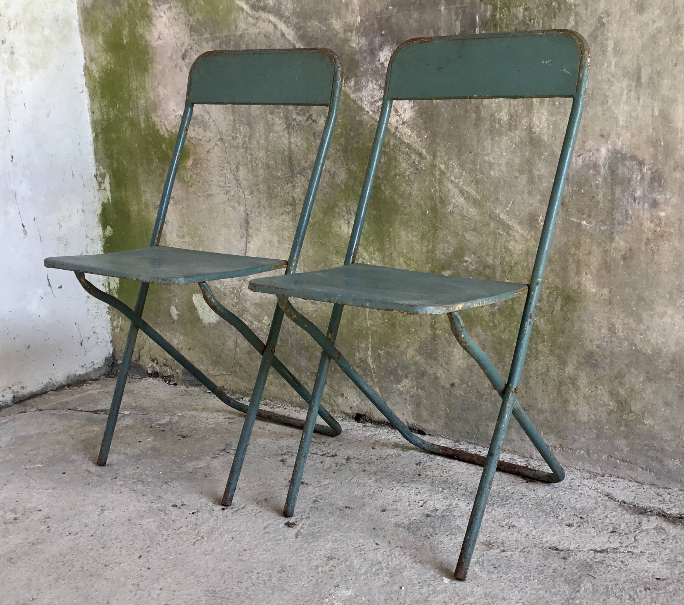 Pair of folding metal chairs, military or industrial, mid-20th century.
