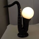 1980' Saxophone lamp in black earthenware & opaline globe