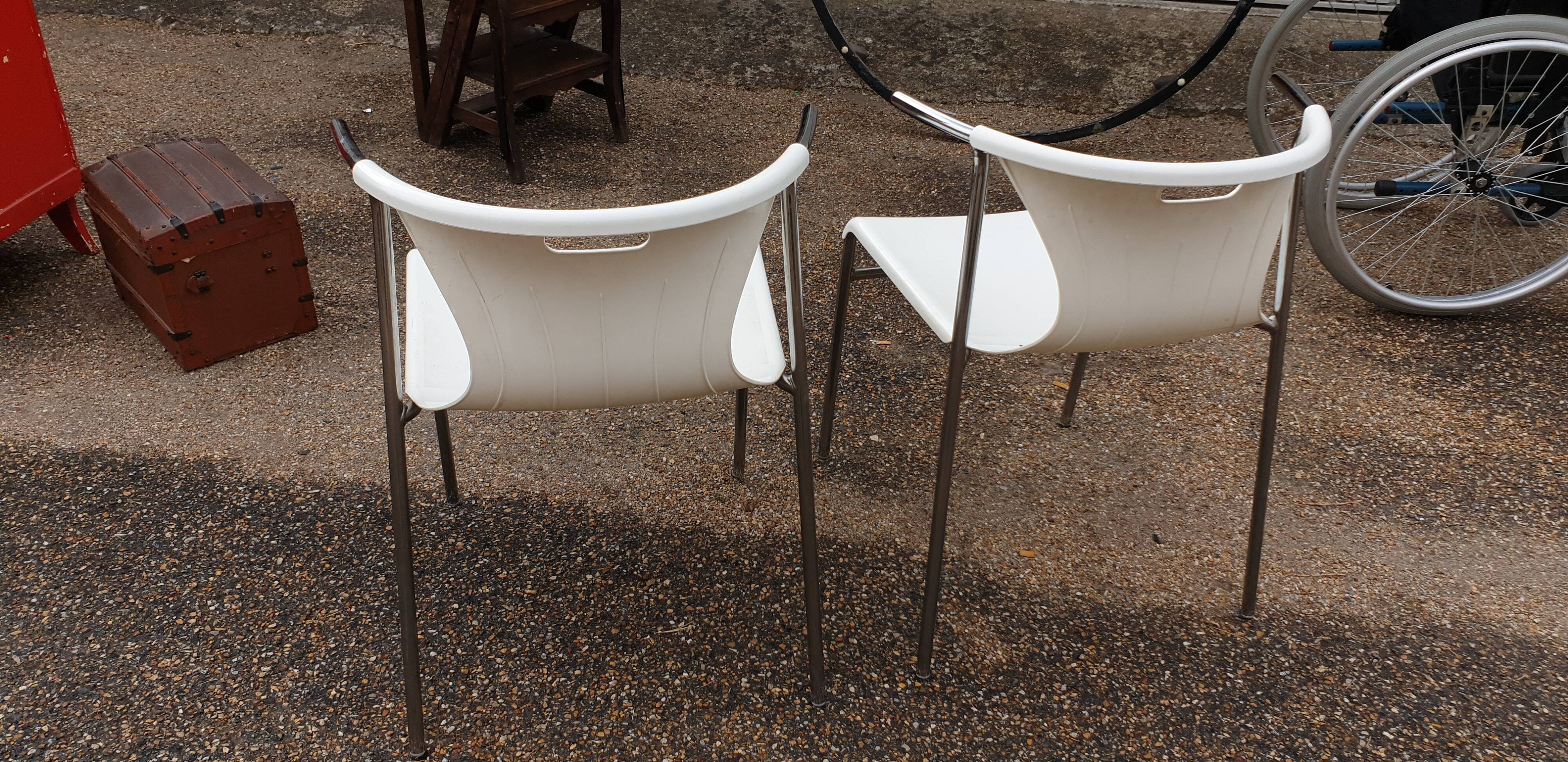 Pair of chrome and resin design armchairs