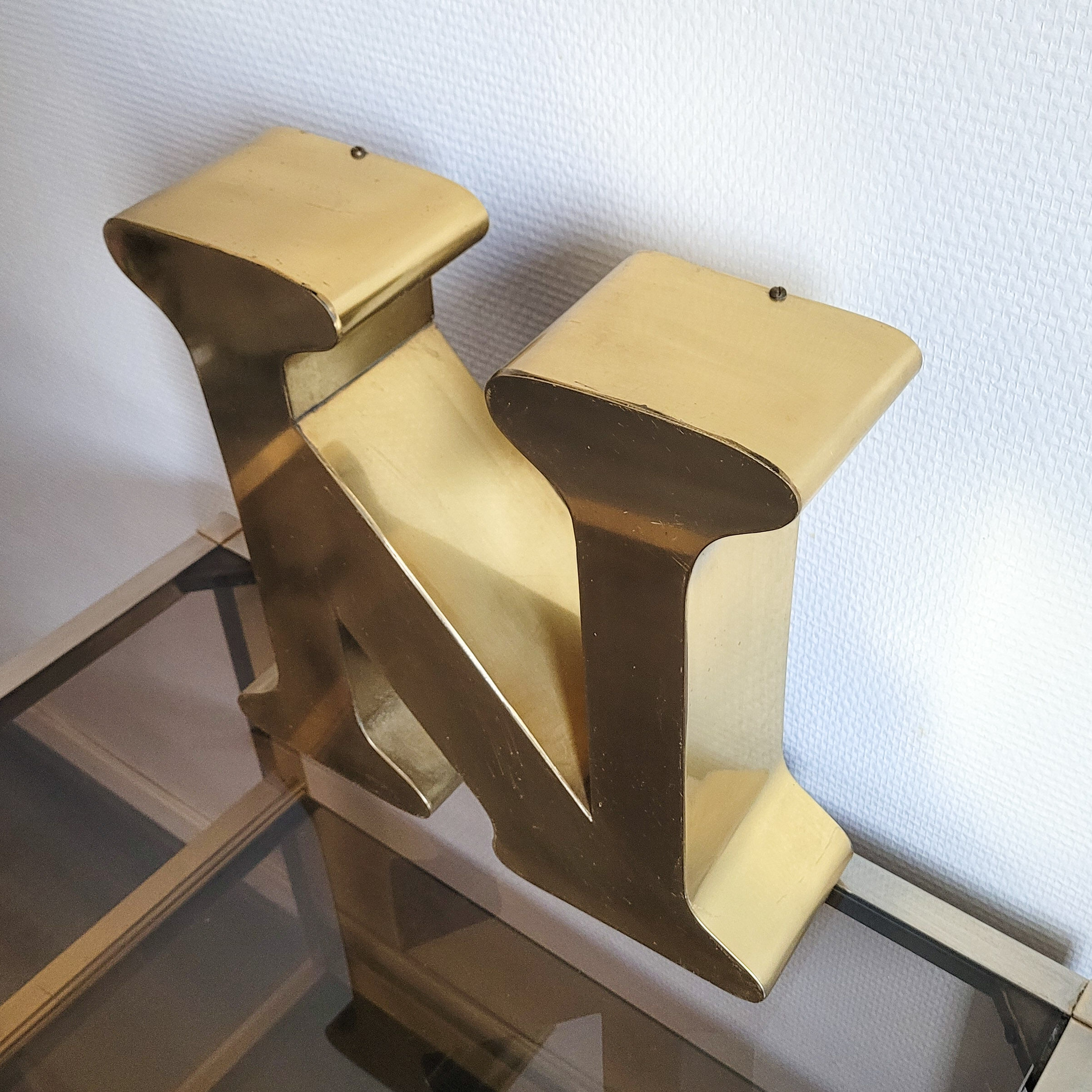 Old letter N of gilded metal sign