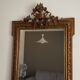 Miroir doré fin 19ème avec  fronton décoré. 150x82.
