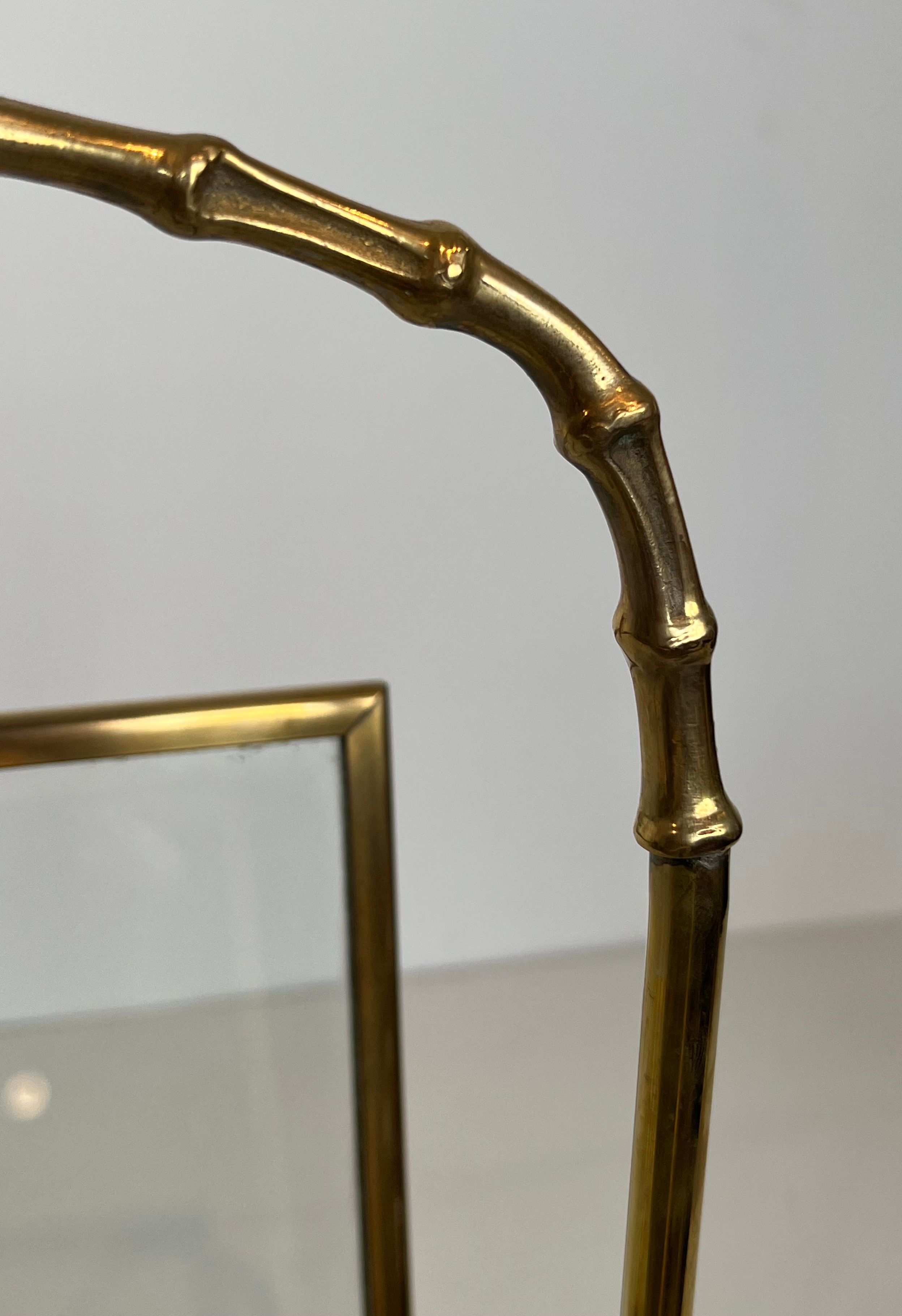 Bronze and brass faux-bamboo magazine rack by the Baguès house.