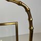 Bronze and brass faux-bamboo magazine rack by the Baguès house.