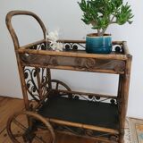 Bamboo and rattan dessert table in peacock style.