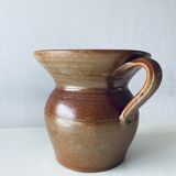 Old pitcher in glazed terracotta